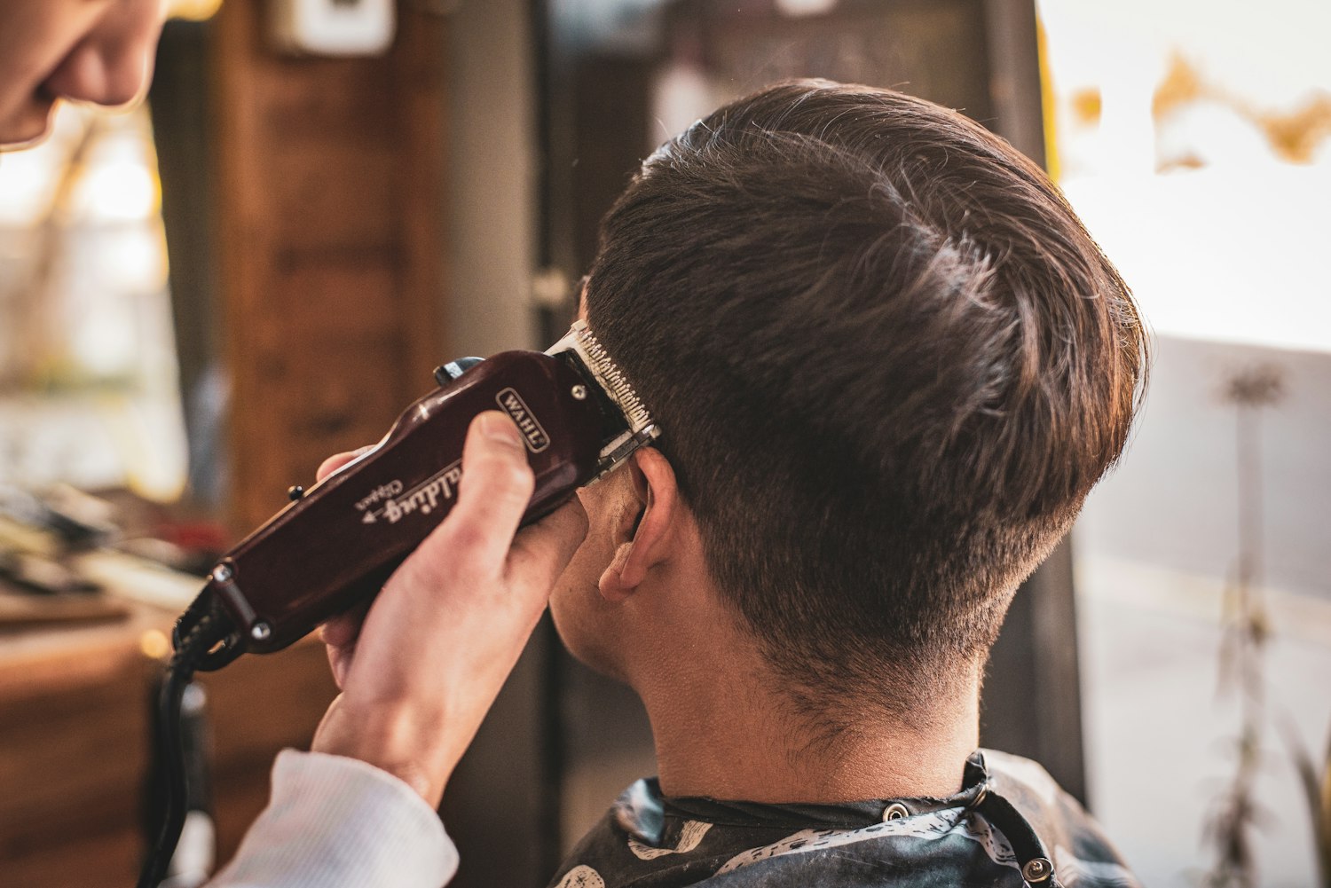 Barber using clippers