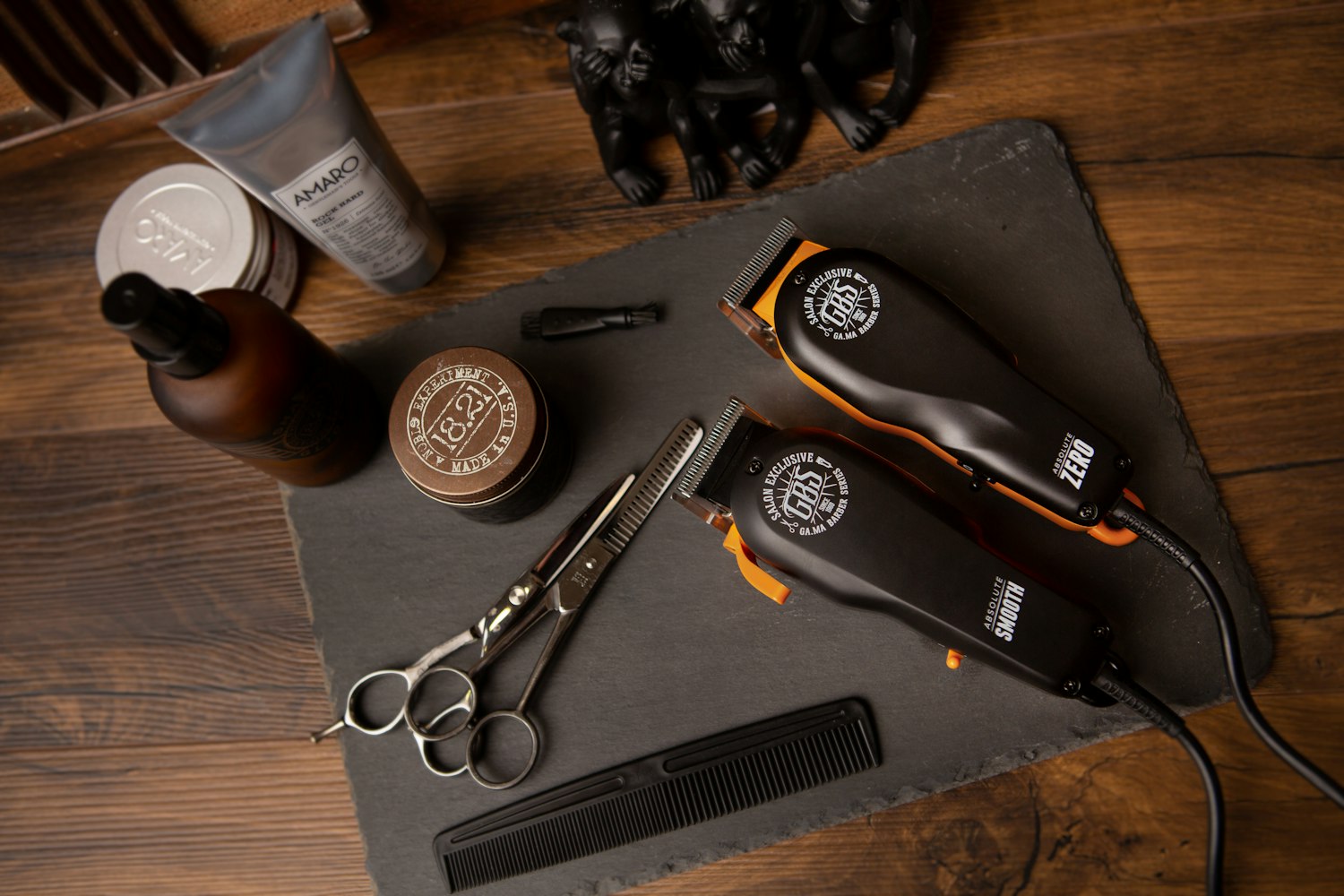 Barber tools laid out on a wooden surface